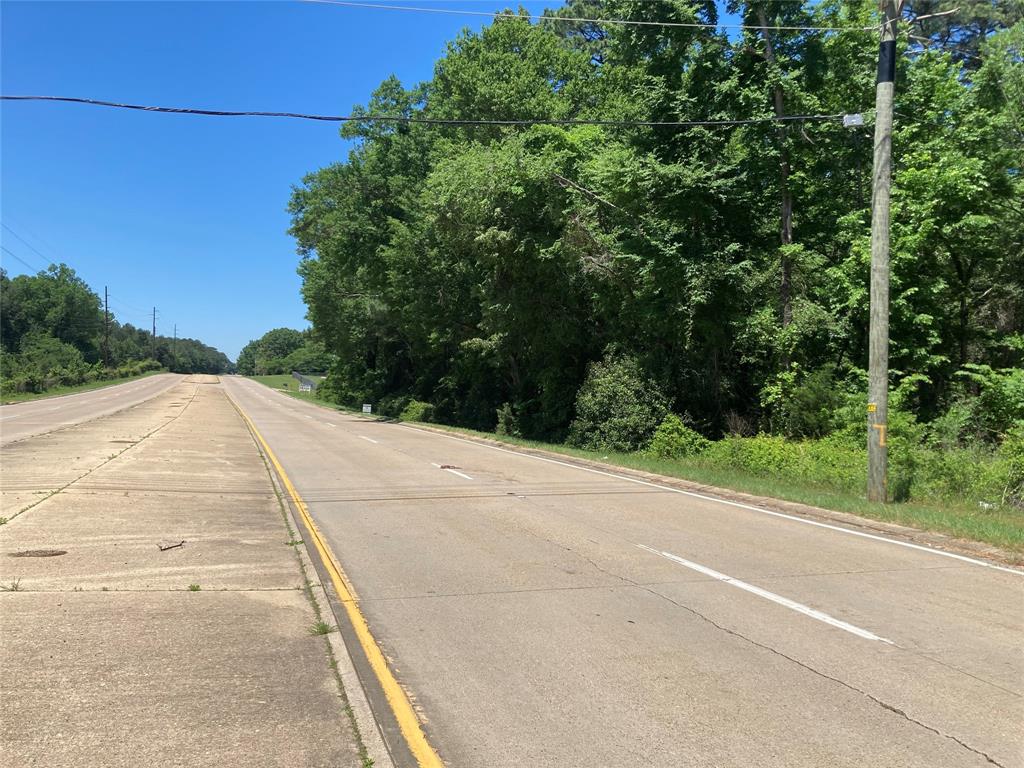 a view of a road with a building in the background