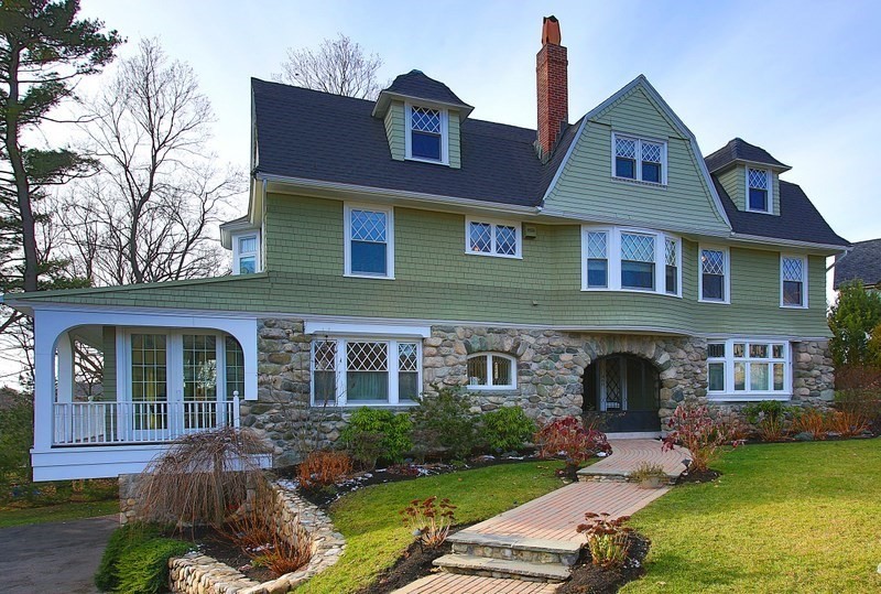 a front view of a house with garden