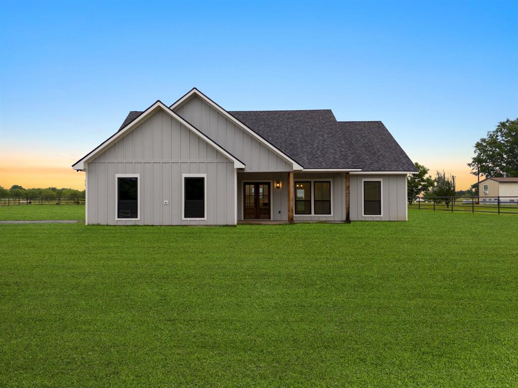 a view of a yard in front of a house with a yard