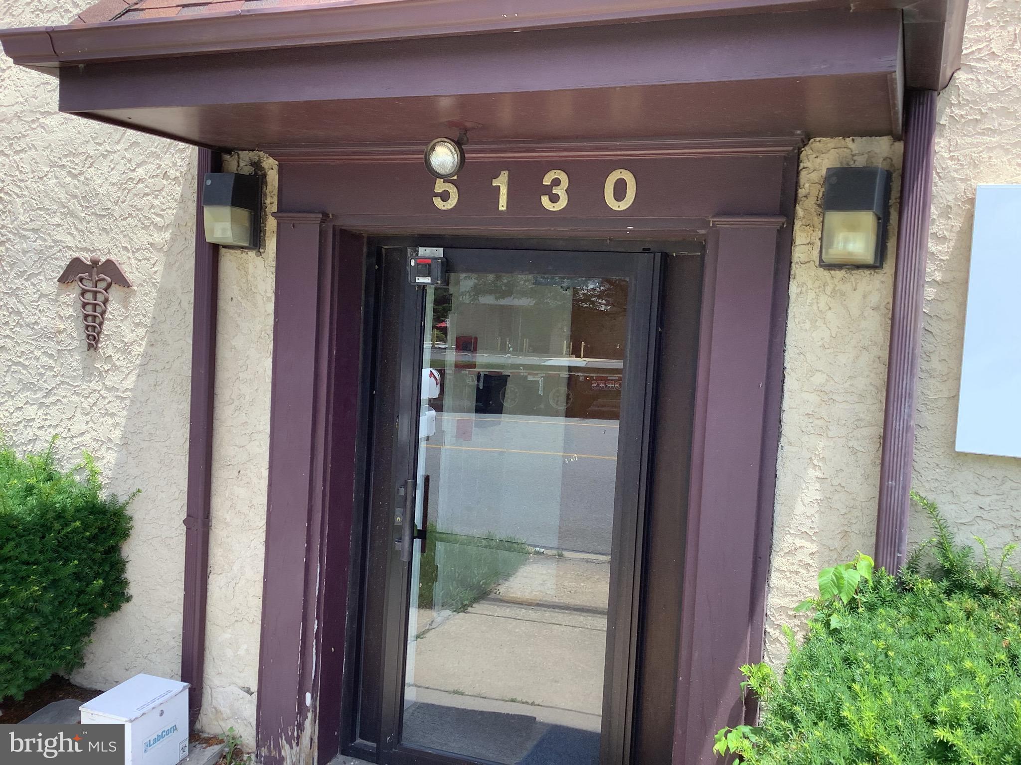 a front view of a house with a glass door