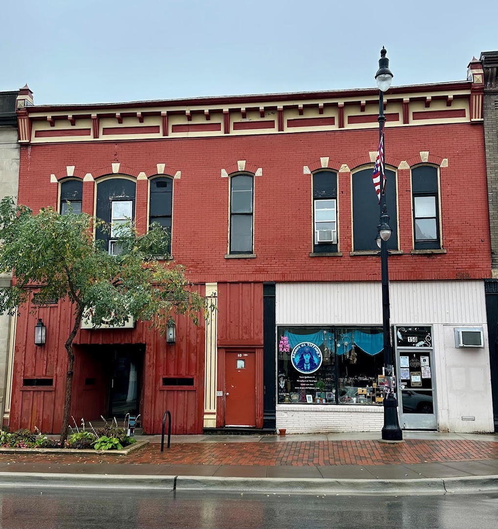 a view of a building with a street