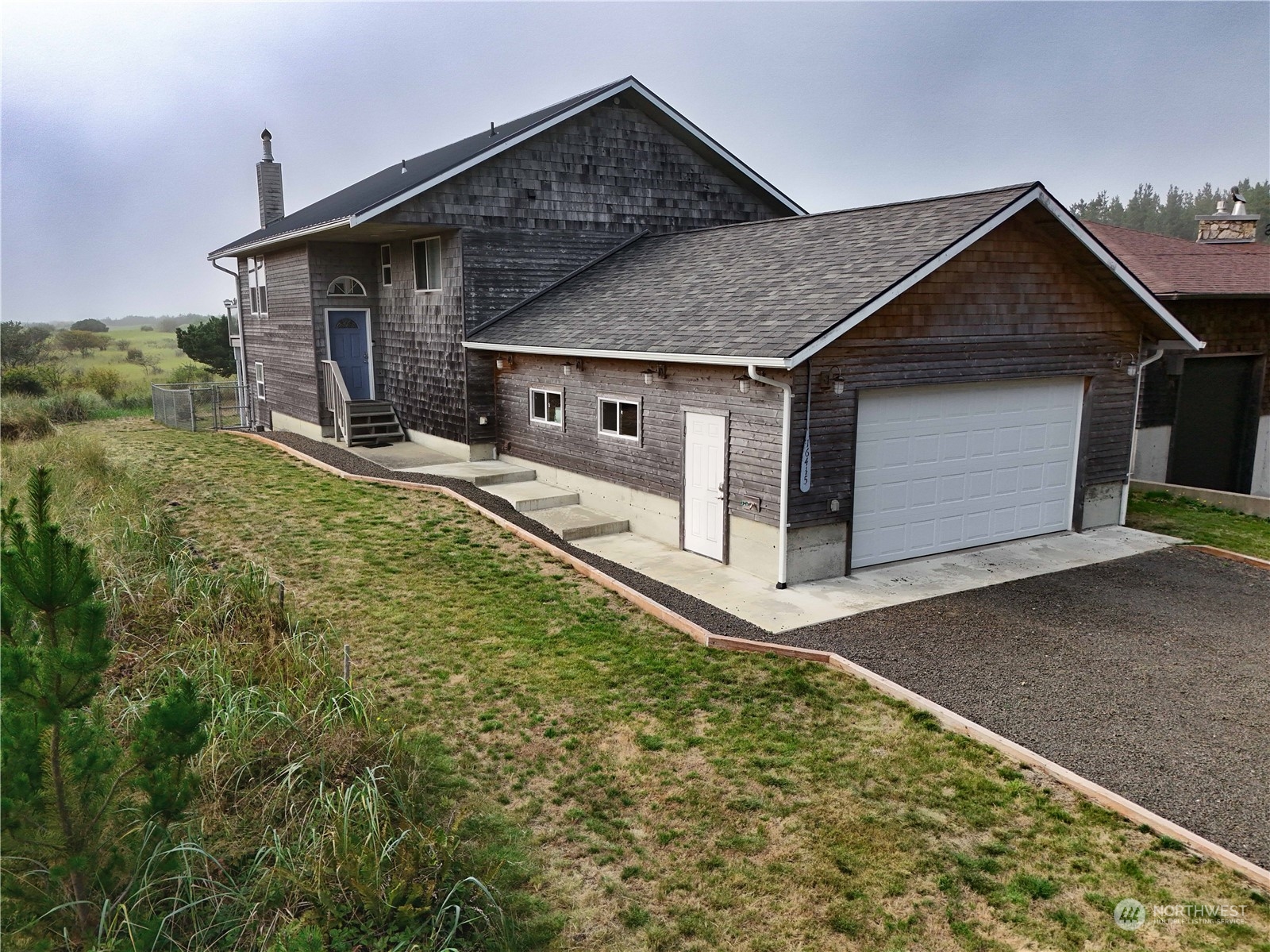 a view of a house with a yard