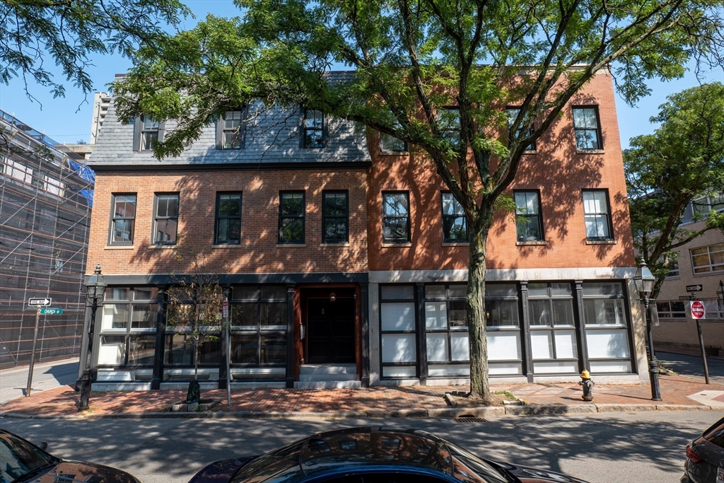 a front view of a houses on city street