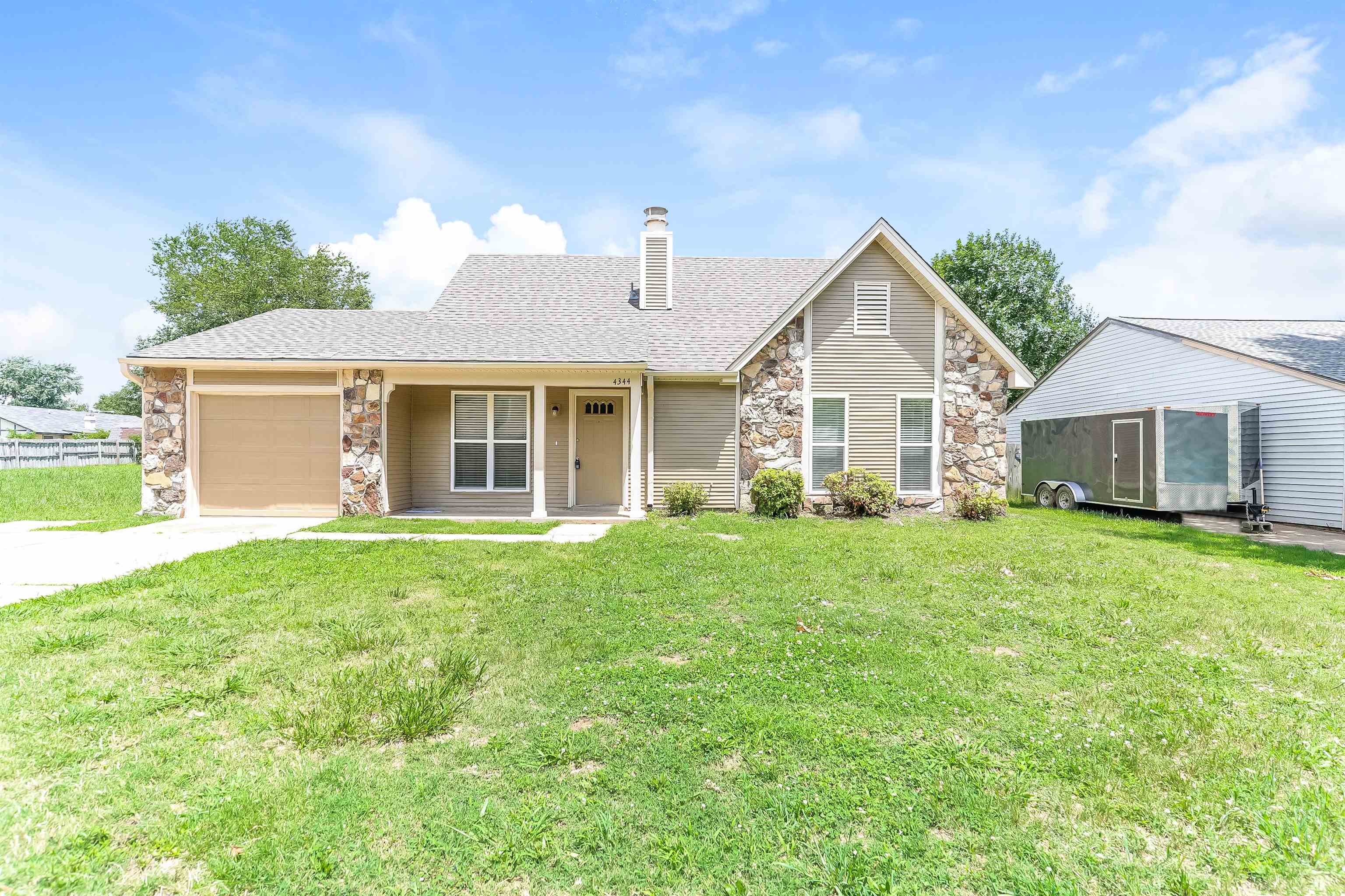 a view of a house with a back yard