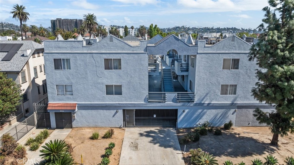 an aerial view of a house with a yard