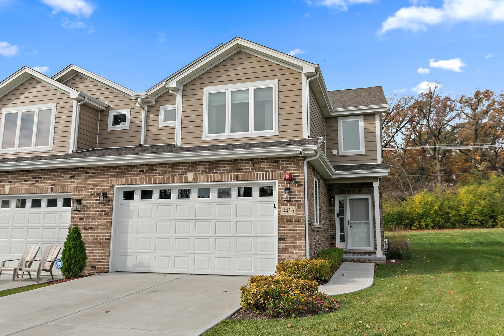 a front view of a house with a yard