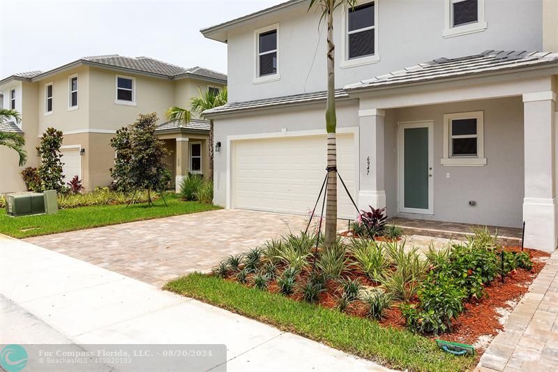 front view of a house with a small yard