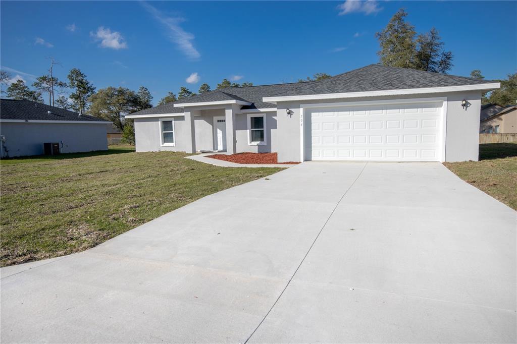 front view of a house with a yard