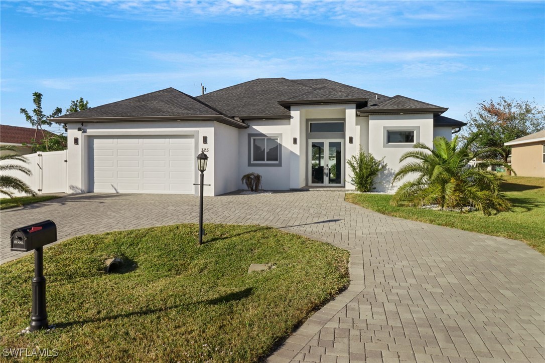 a front view of a house with a yard