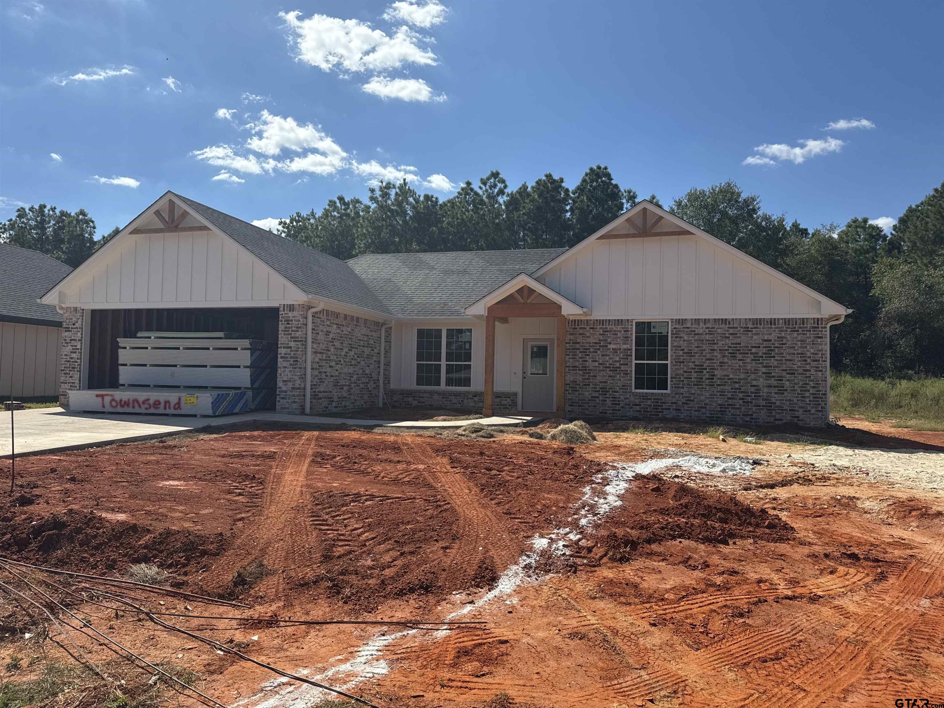 a front view of a house with yard