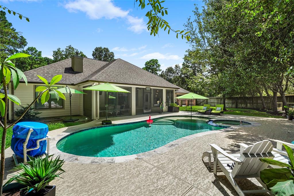 a view of a house with backyard sitting area and garden