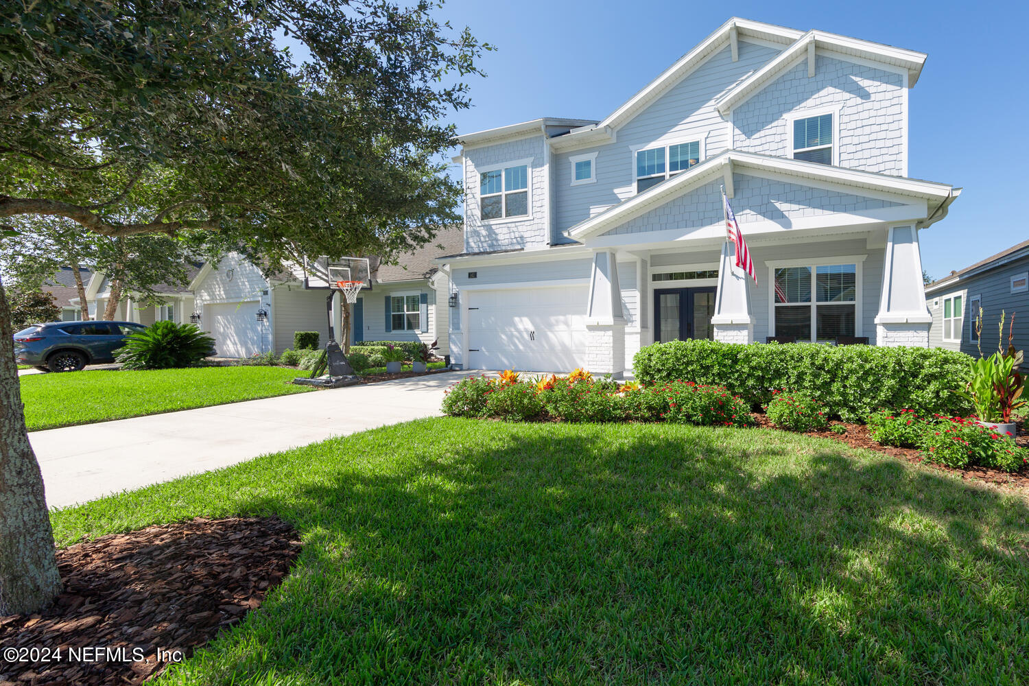 a front view of house with yard and green space