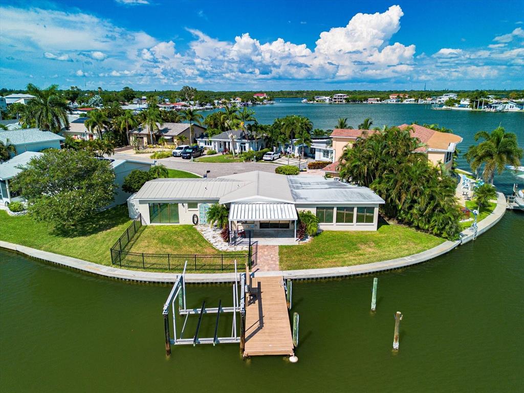 an aerial view of a house with a ocean view