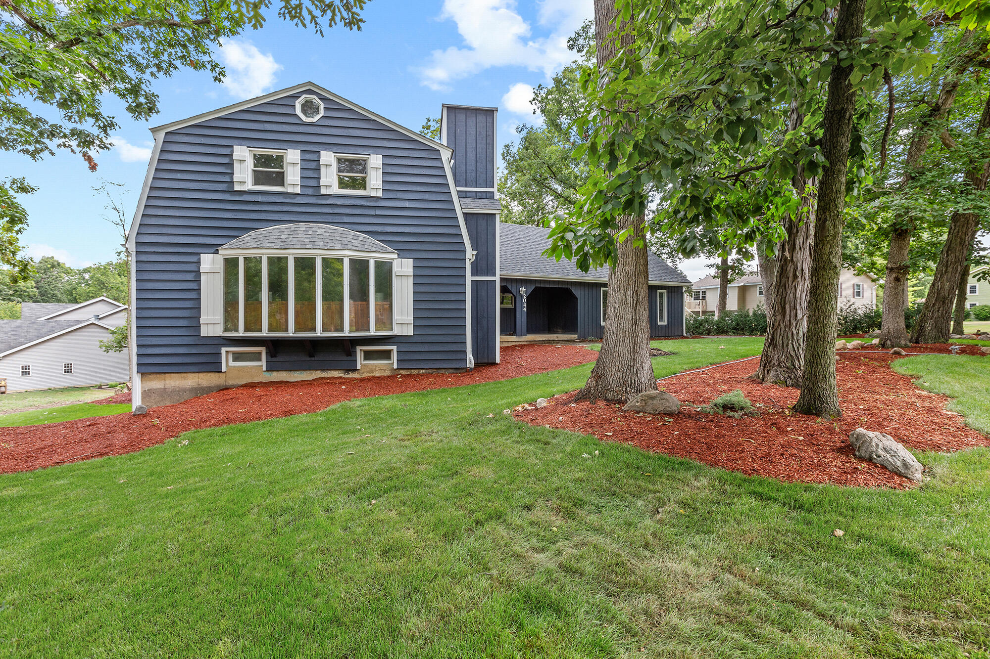 a front view of a house with a yard