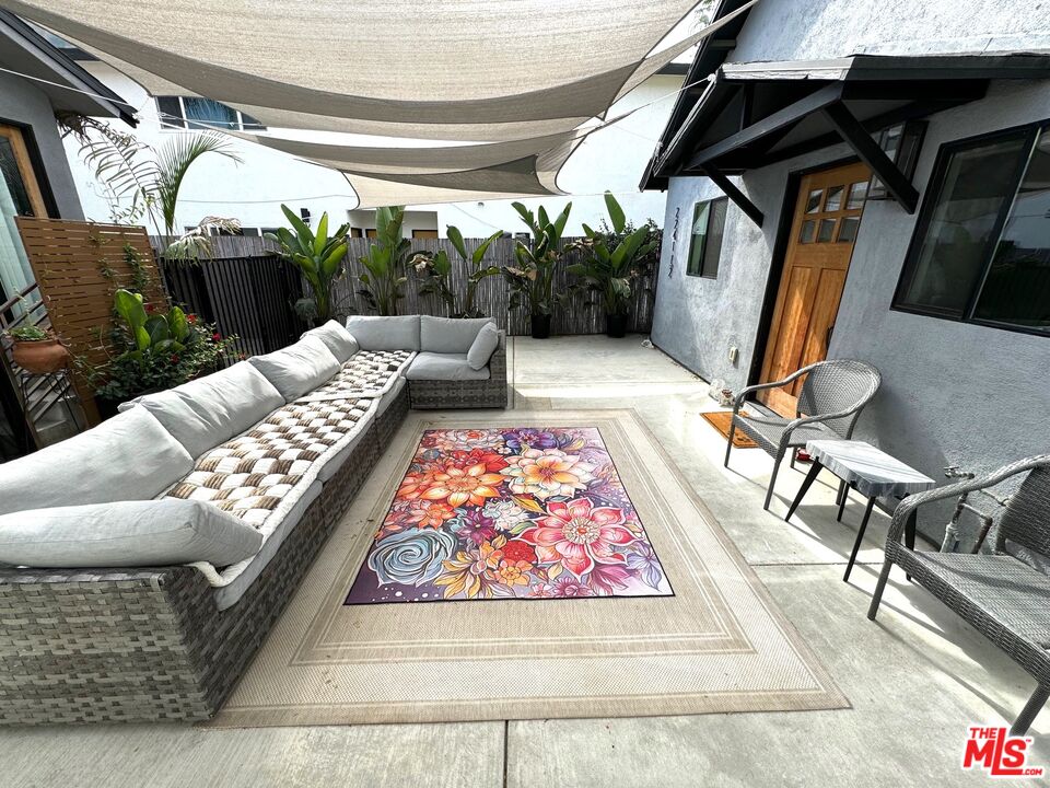 a living room with furniture and a rug