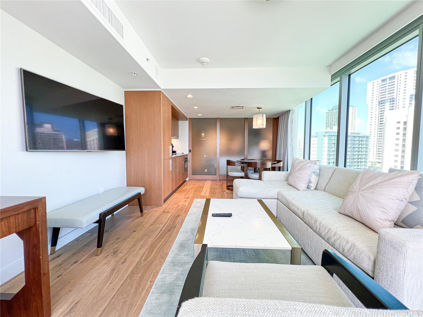 a living room with furniture rug and window