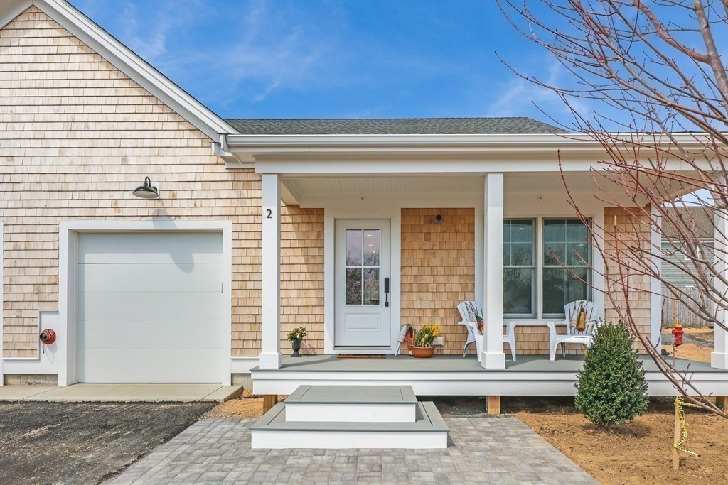 a front view of a house with a porch