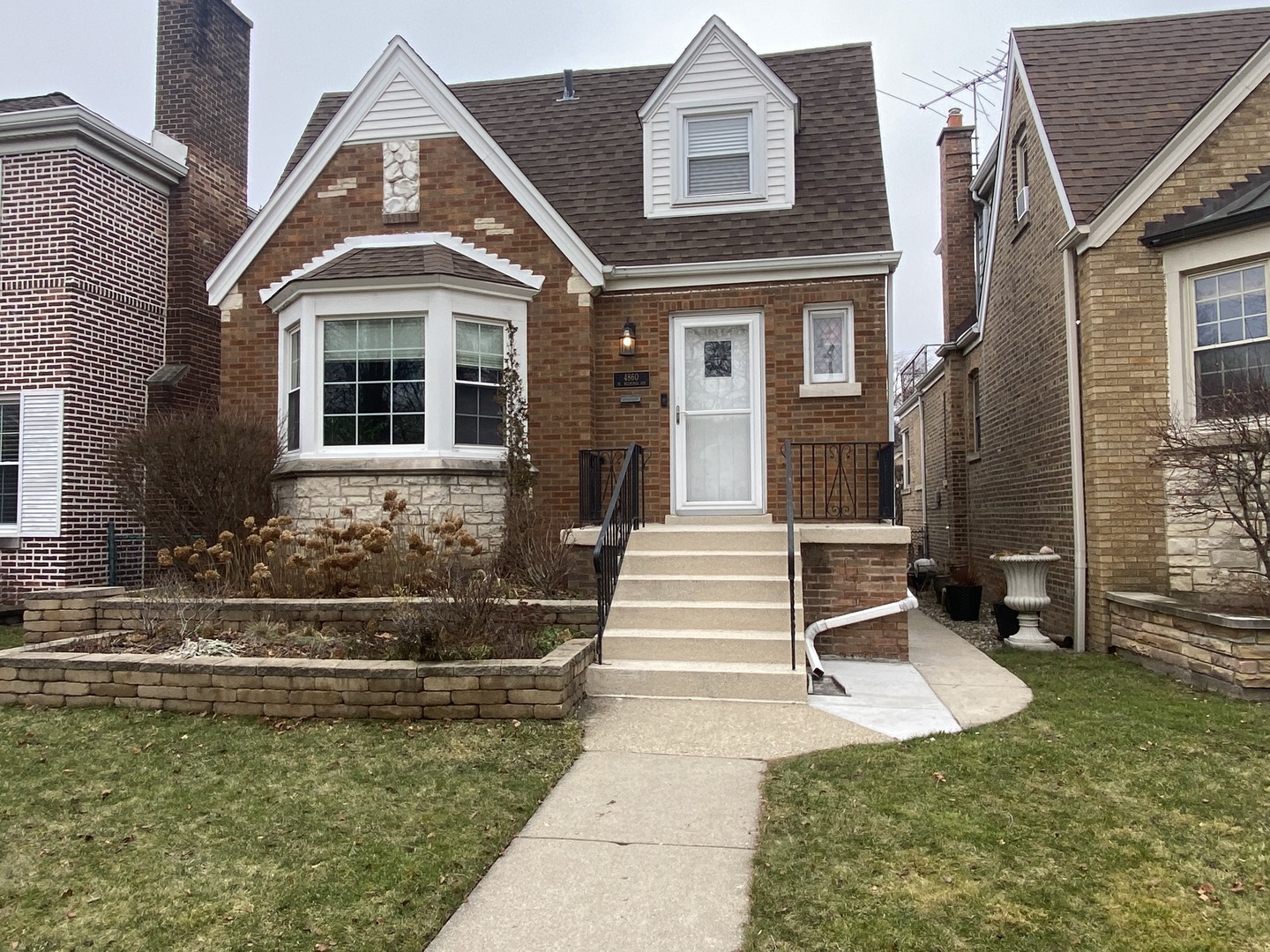 front view of a house with a yard