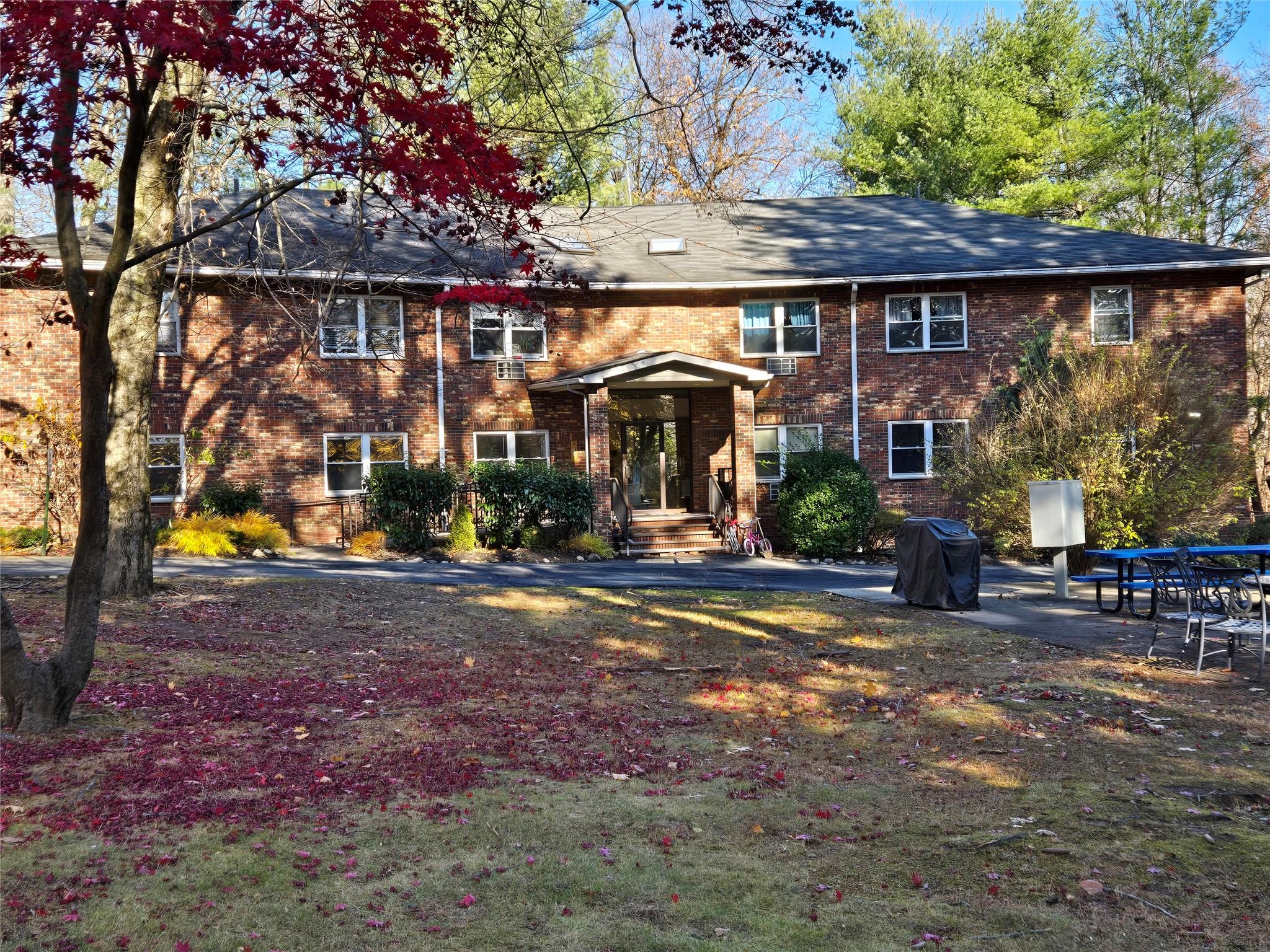 a view of large building with a yard