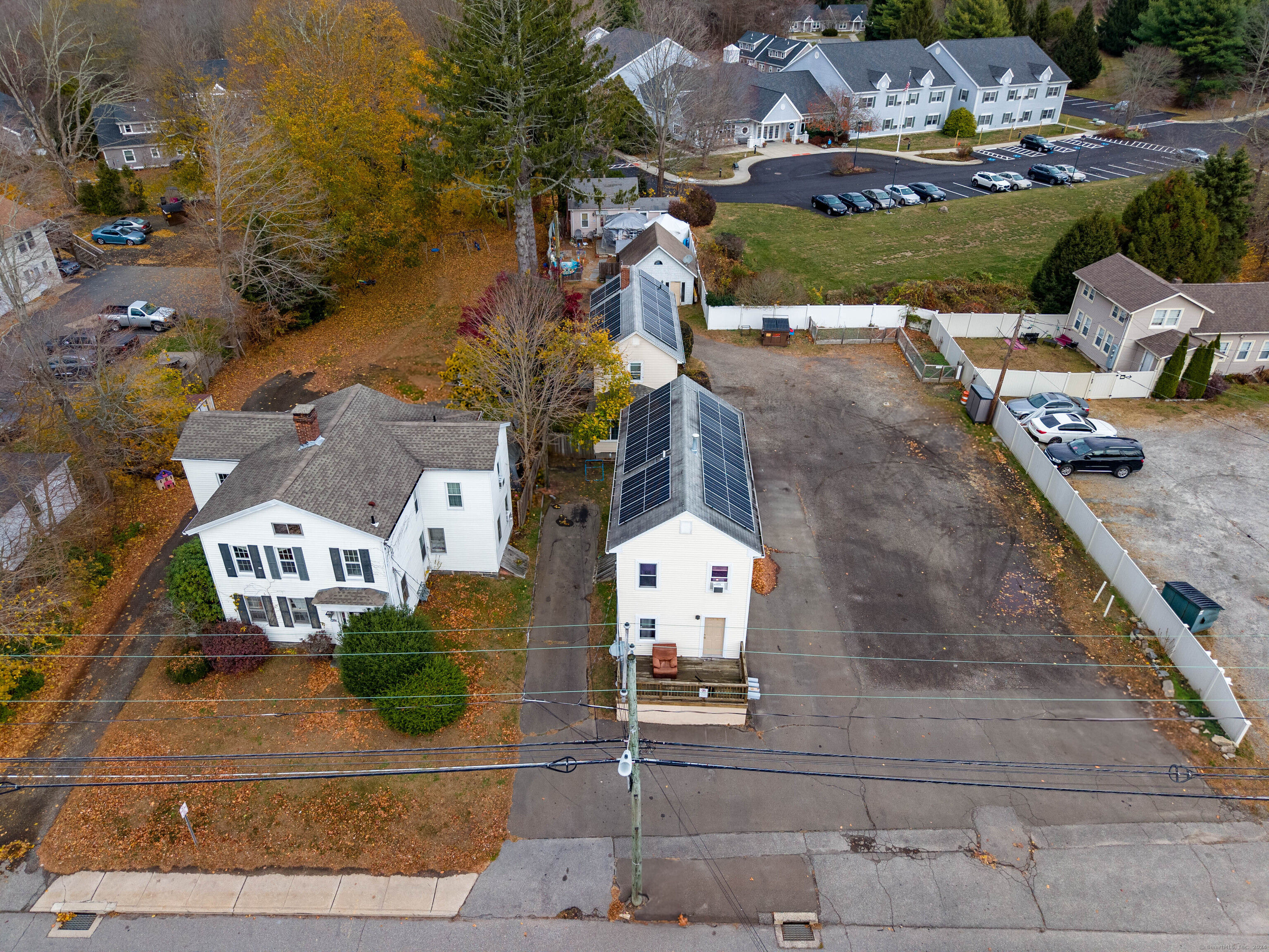 an aerial view of a house with a garden and mountain view