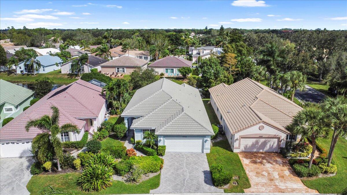 an aerial view of multiple houses with a yard