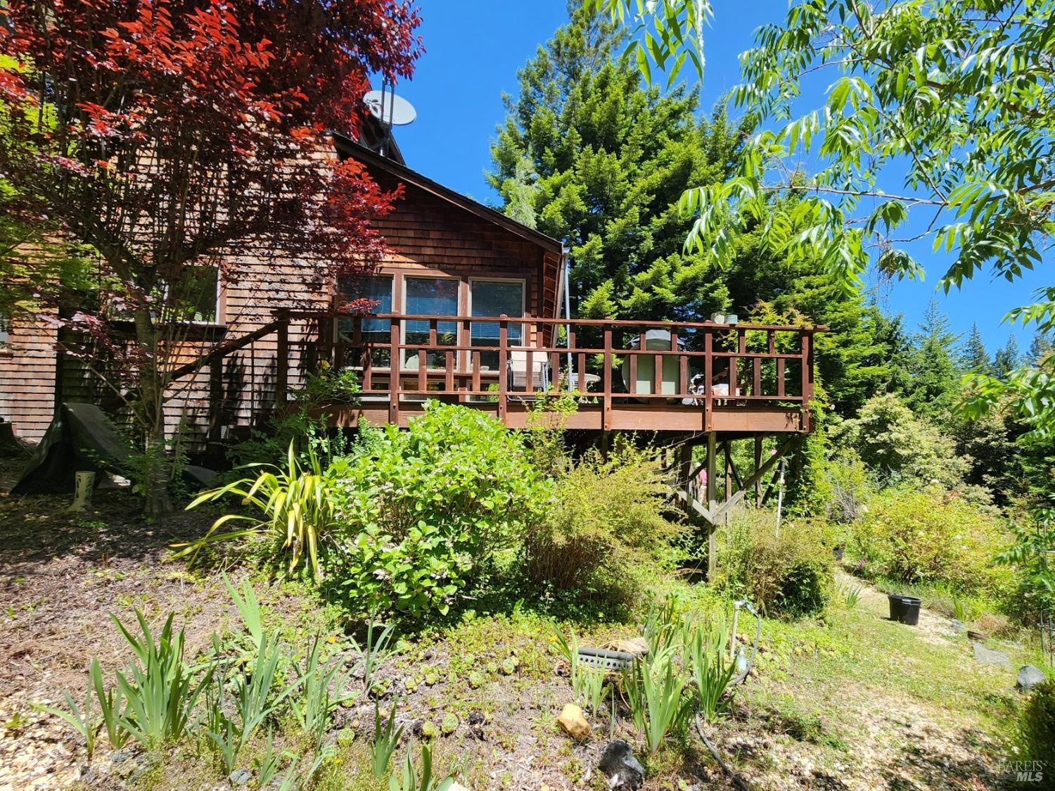 a view of house with yard outdoor seating and green space