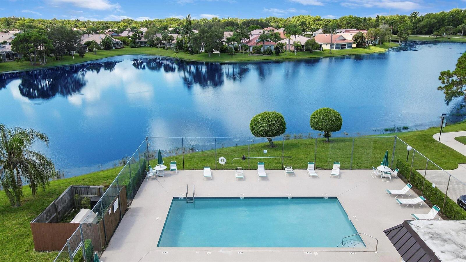 an aerial view of a house with a lake view