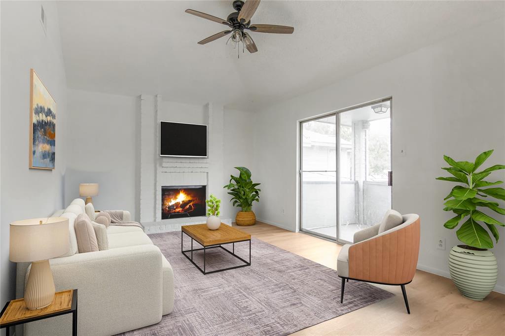 a living room with furniture and a potted plant