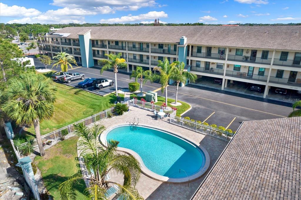 a view of a swimming pool with a patio