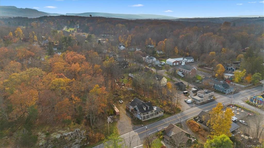 Birds eye view of property with a mountain view