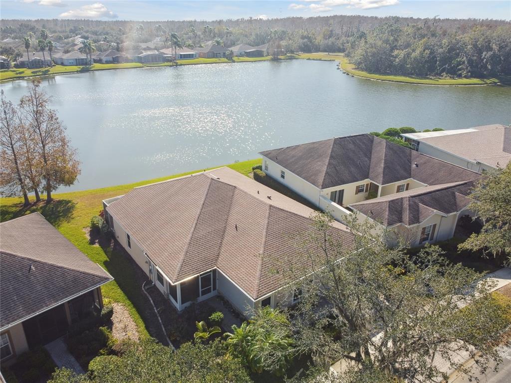 an aerial view of a house with a lake view