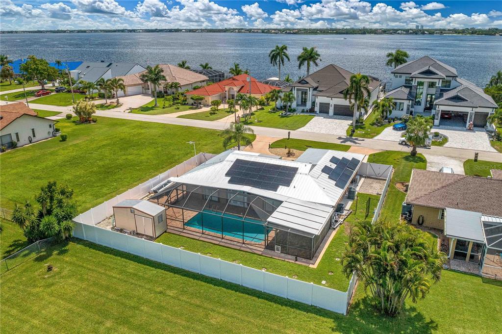 an aerial view of a house with a ocean view