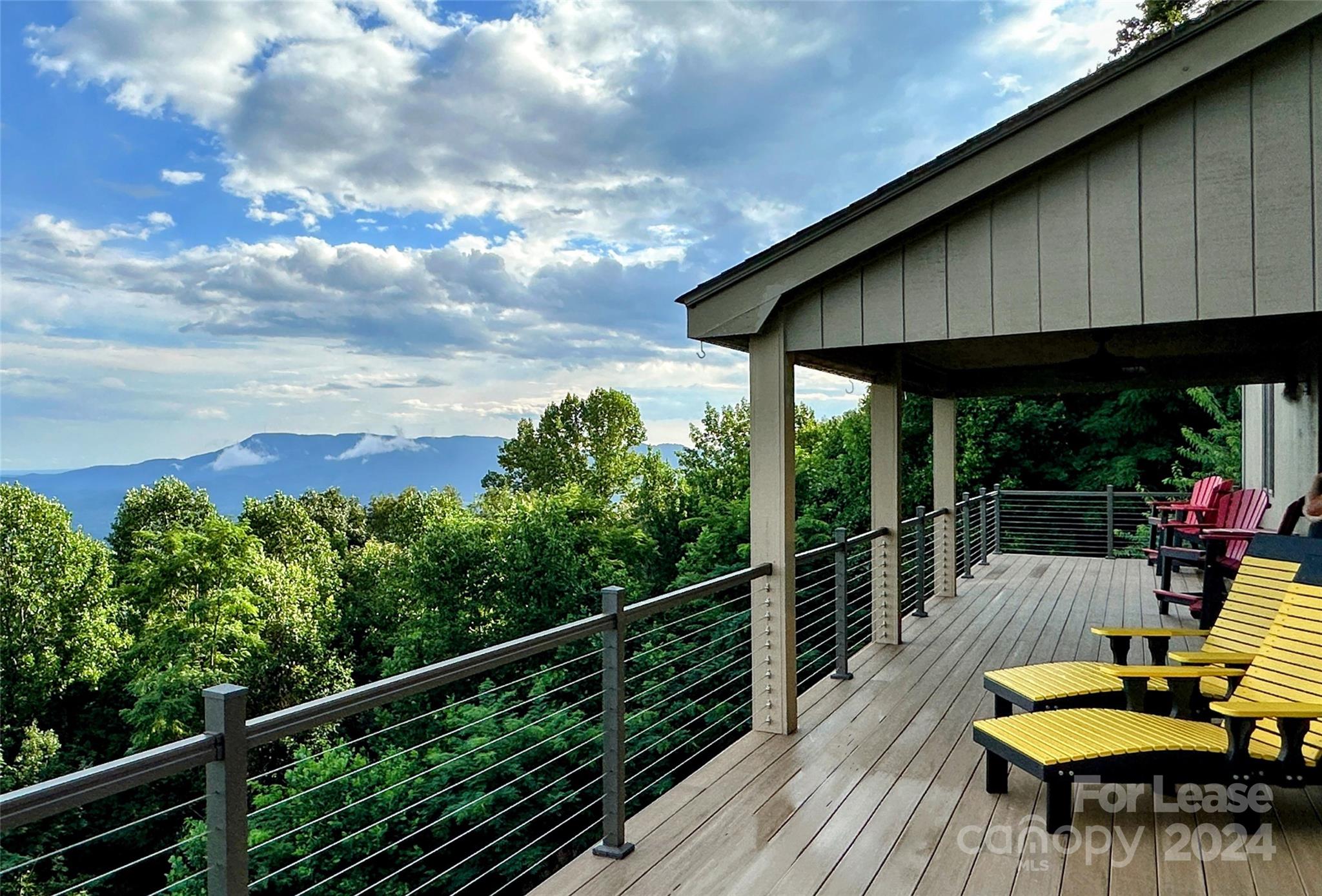 a view of a chairs and table in the balcony