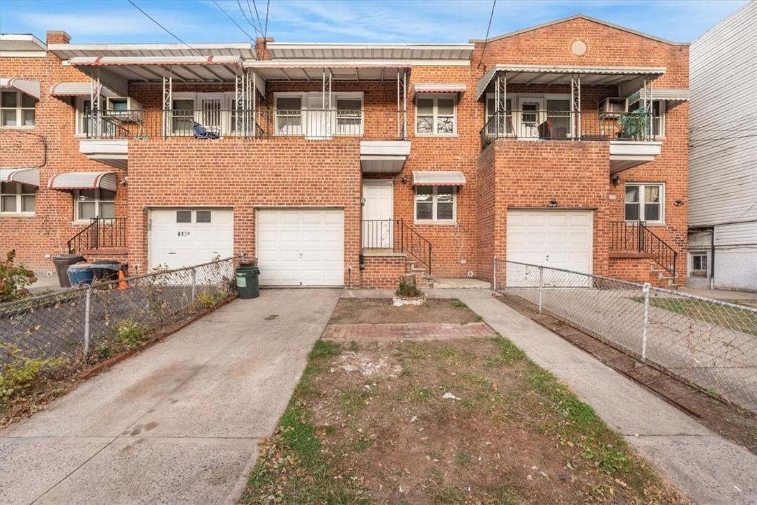 Multi unit property with a garage and a balcony