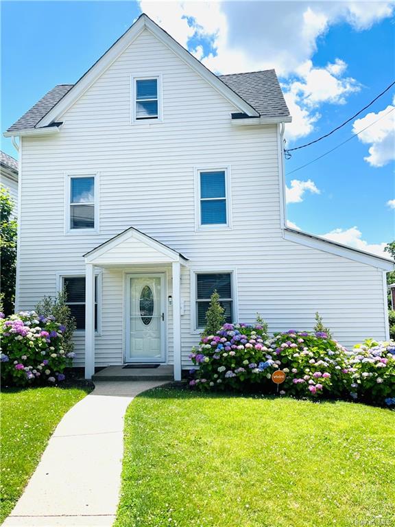 a front view of a house with a yard