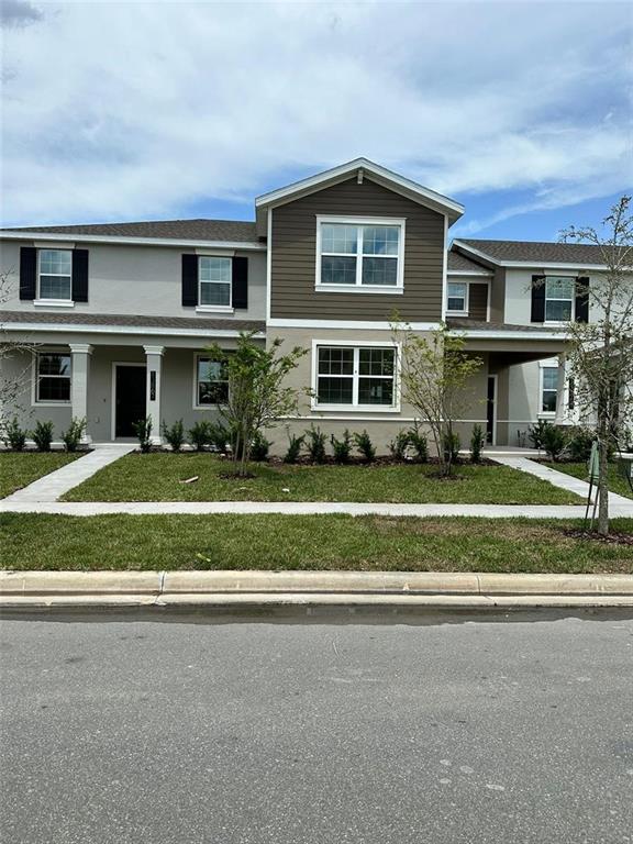 a front view of a house with a yard