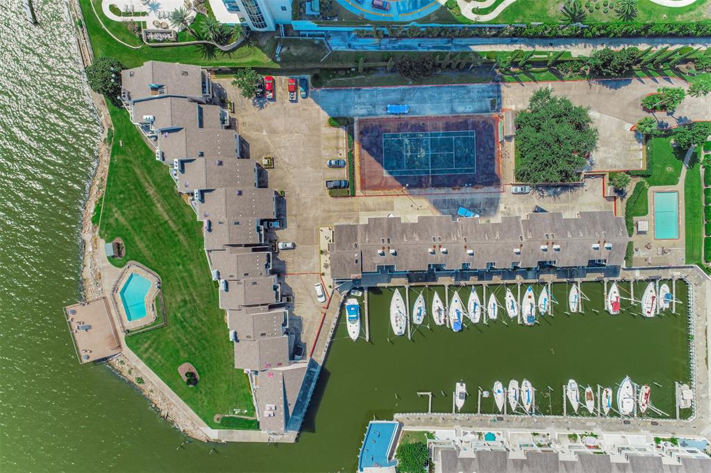 an aerial view of a house with lake view