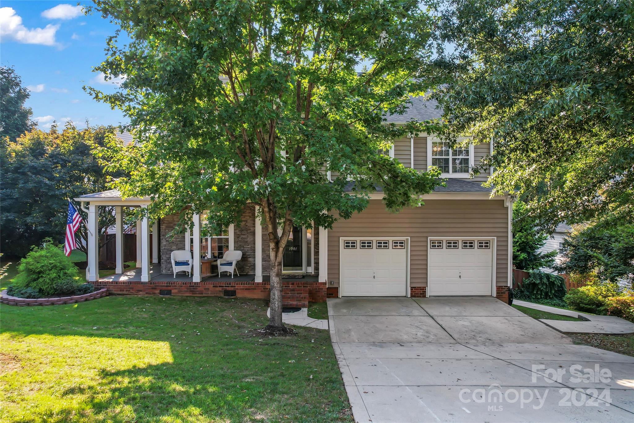 front view of a house with a yard