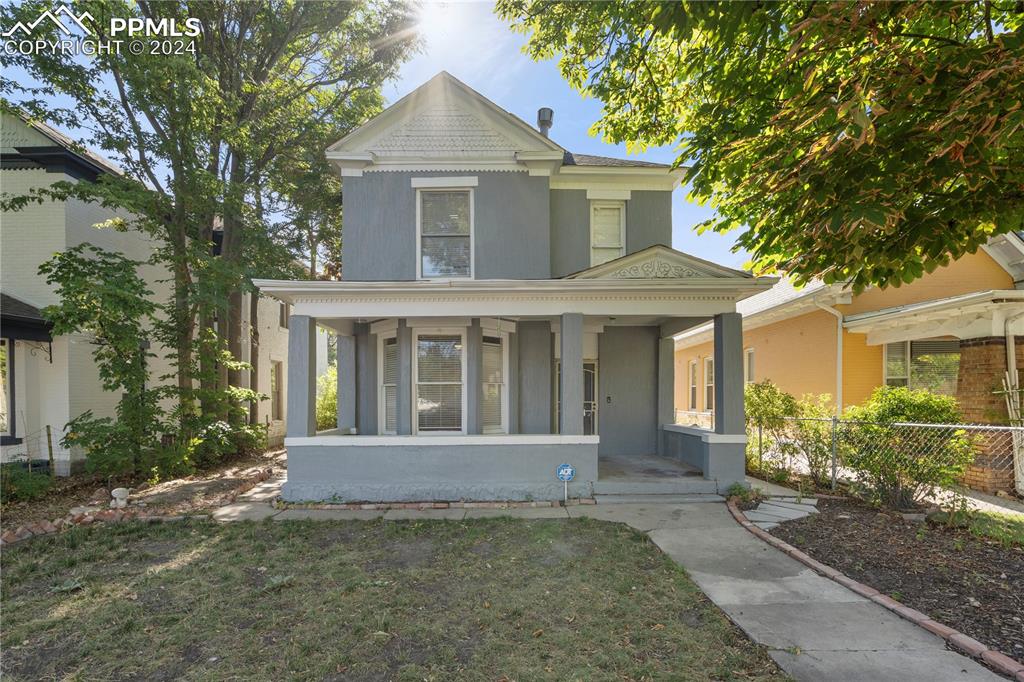 front view of a house with a yard