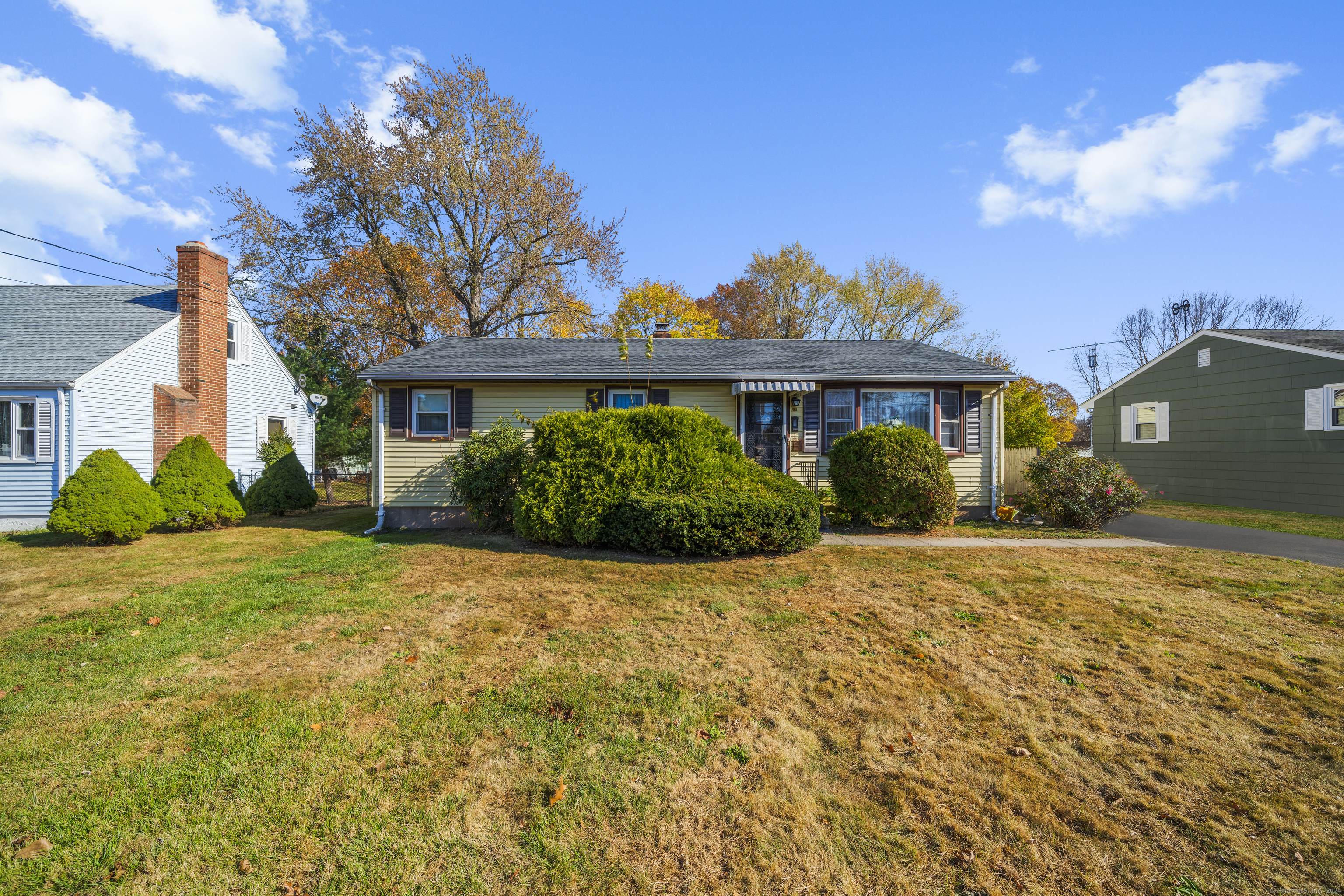 a front view of a house with a yard