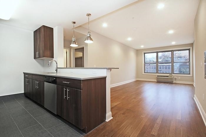 a kitchen with a sink and large window