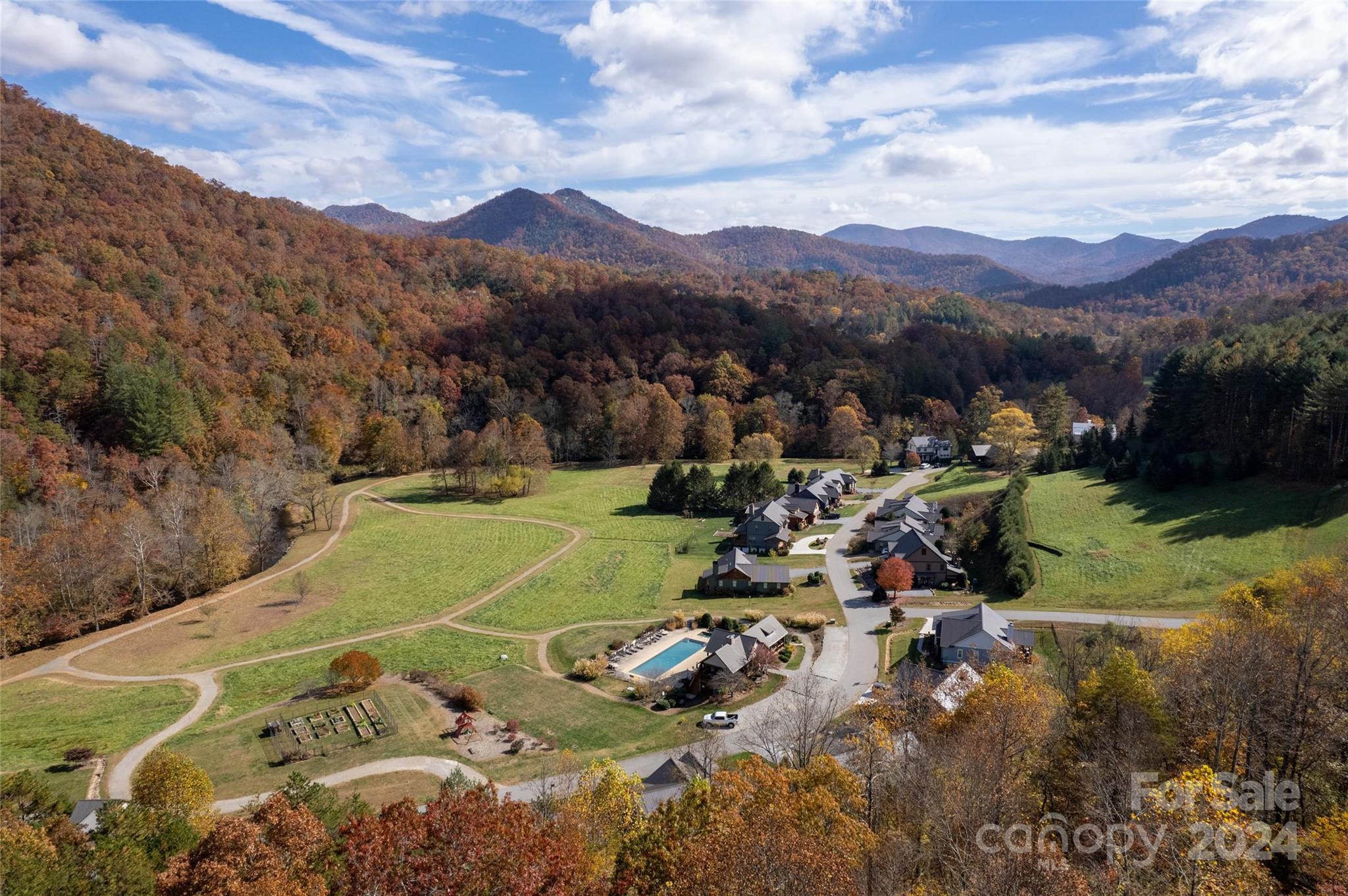 a view of a town with mountains in the background