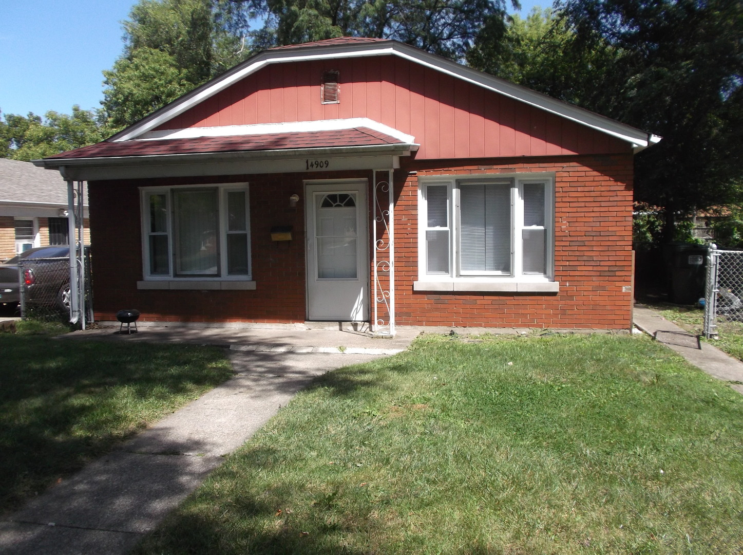 a front view of a house with yard