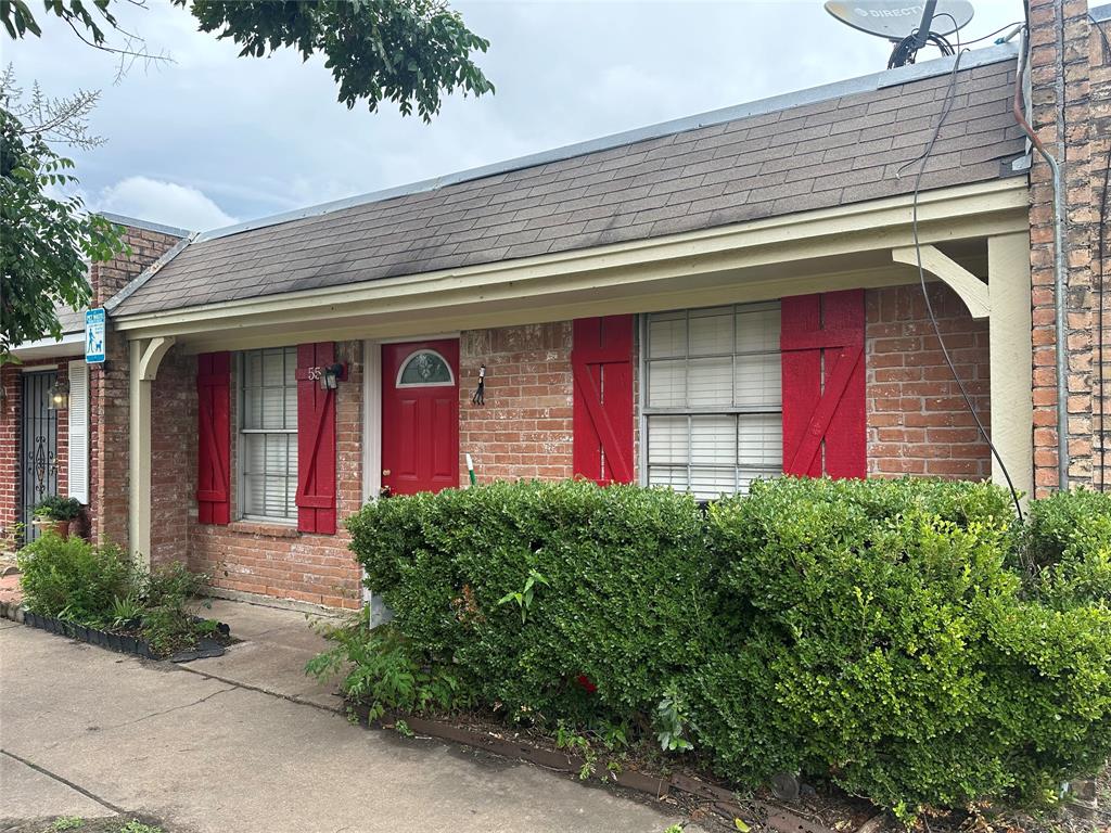 a front view of a house with garage