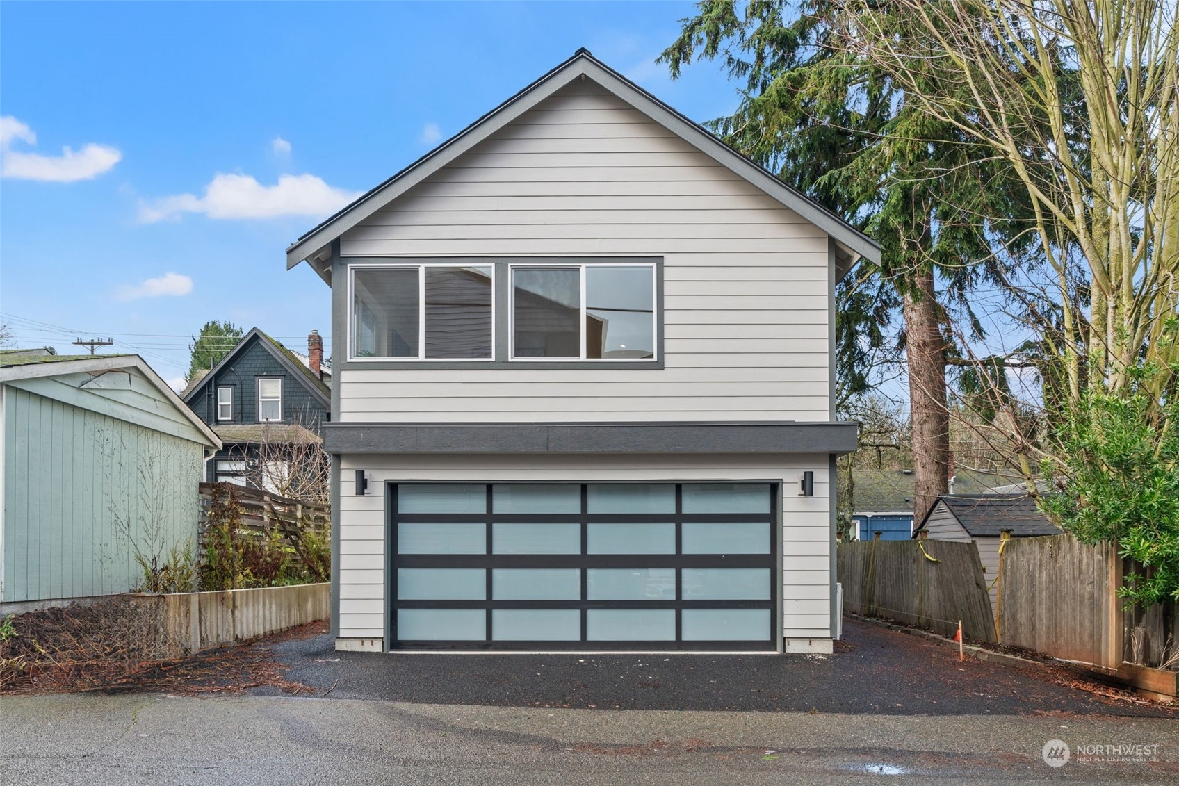 a front view of a house with a garage