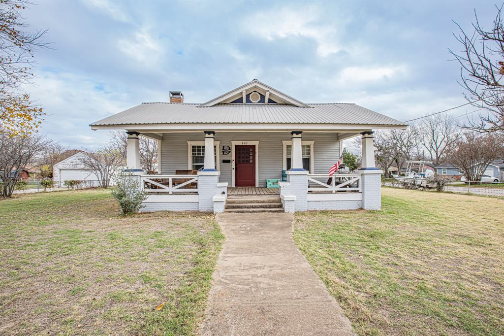 a view of a house with swimming pool and porch with furniture