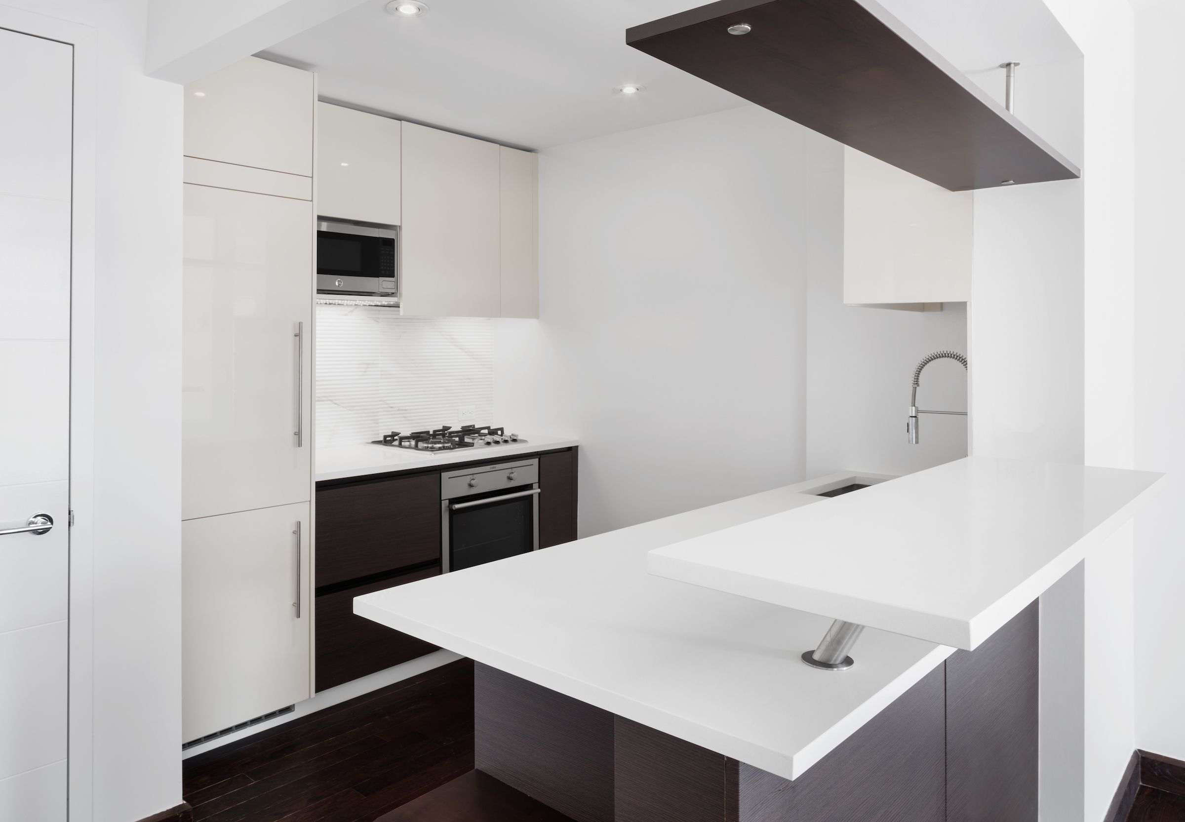 a kitchen with a sink a stove and refrigerator