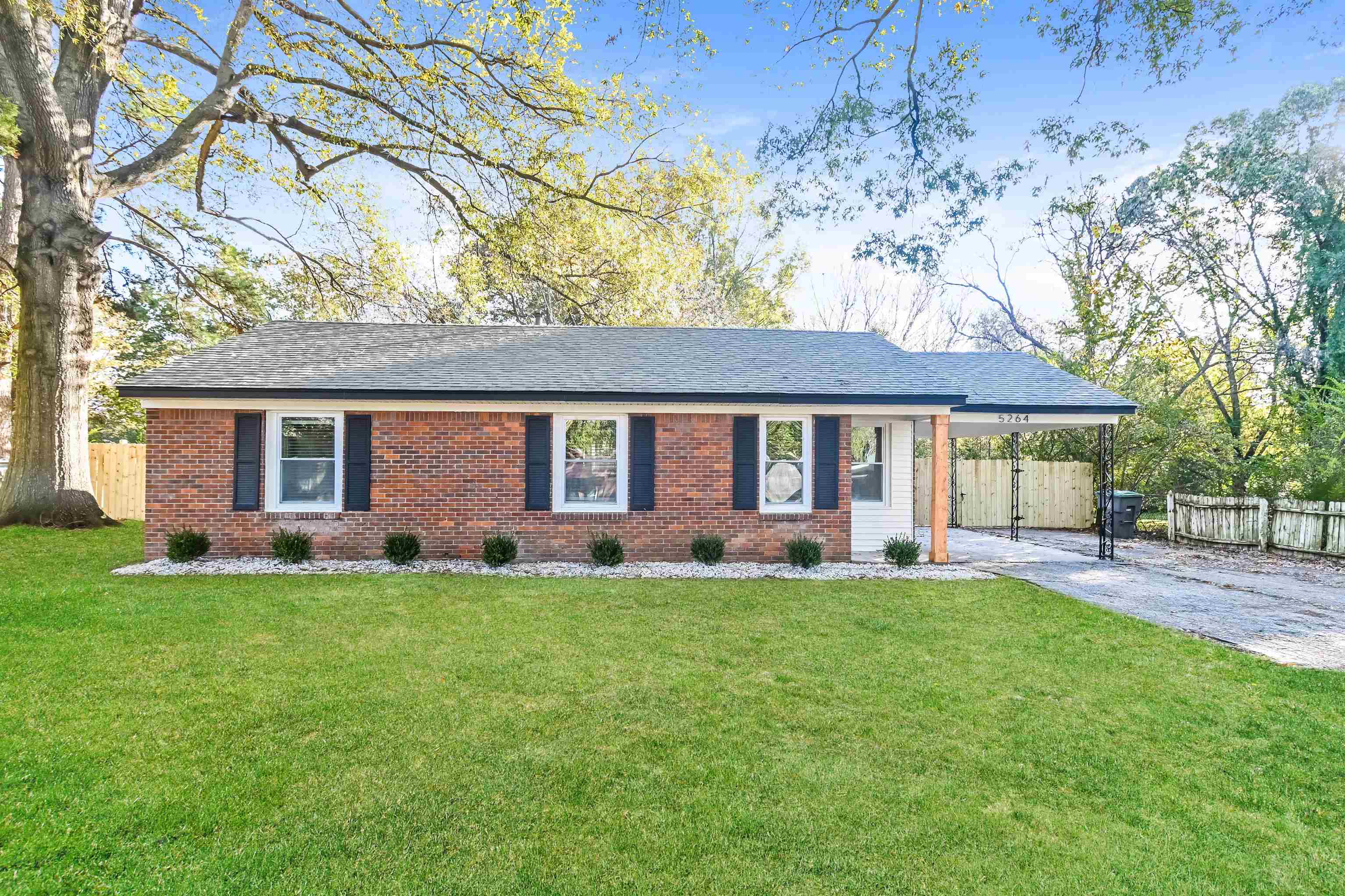 front view of a house with a yard