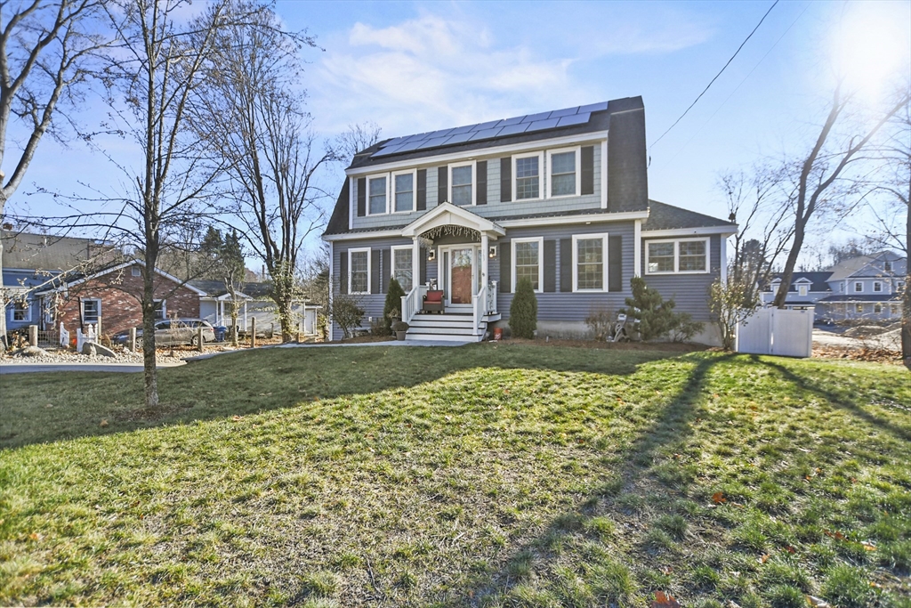 a front view of a house with a yard