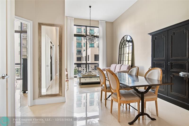 a view of a a dining room with furniture window and outside view